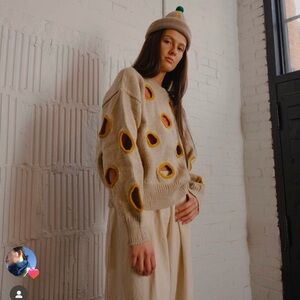 Degen “Holes” wool sweater. NWT, size L/XL.